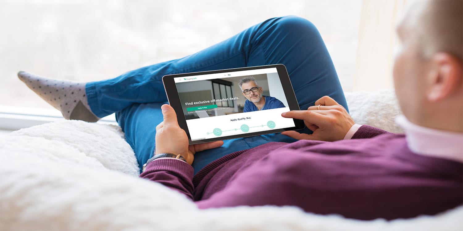 Man searching for homes on PropertyLark.com